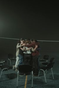 Group of People Standing on Stage